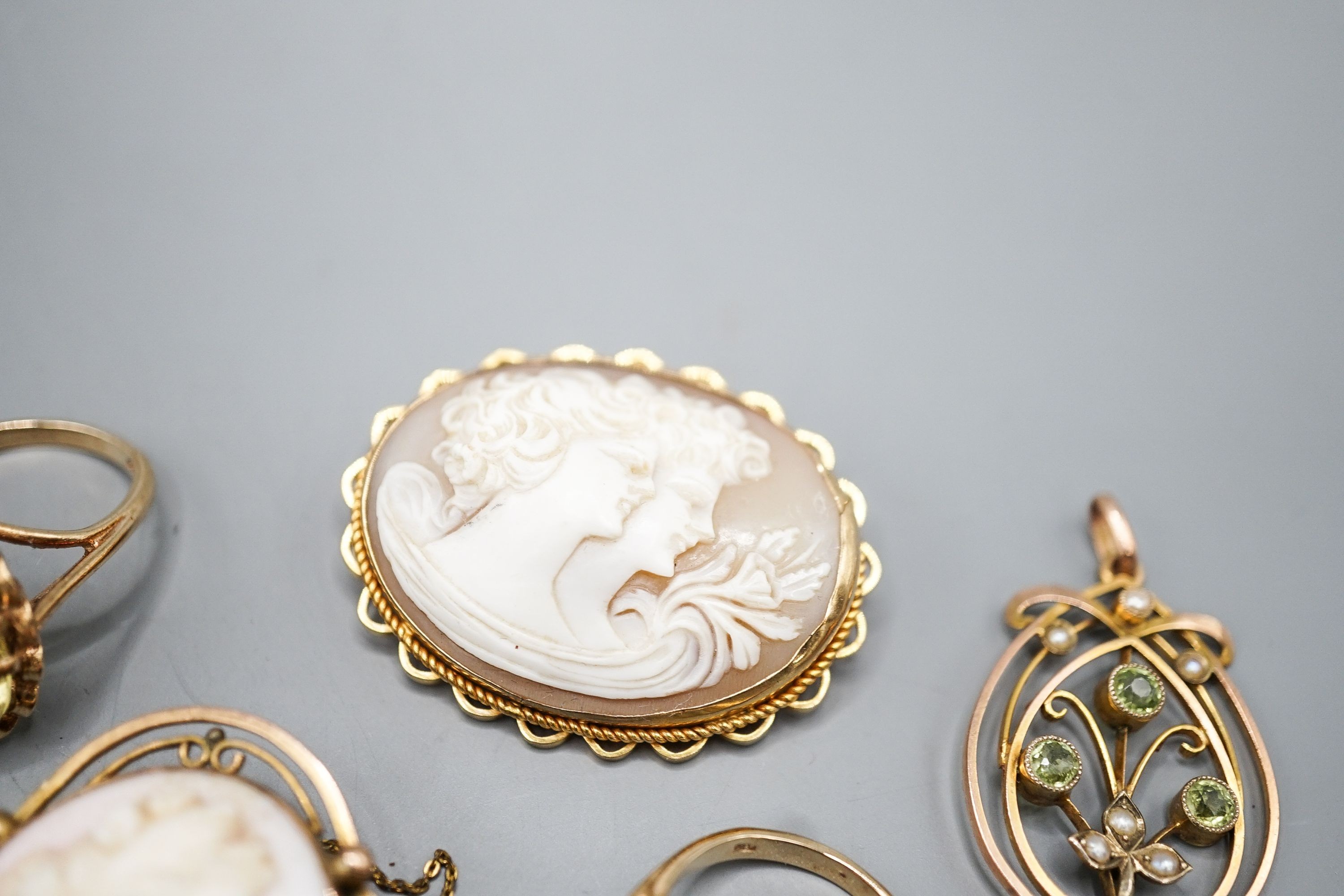 Two modern 9ct gold and gem set rings, a 9ct and gem set pendant, two 9ct mounted cameo shell brooches, gross weight 36.5 grams and a Victorian oval pendant frame, 55mm.